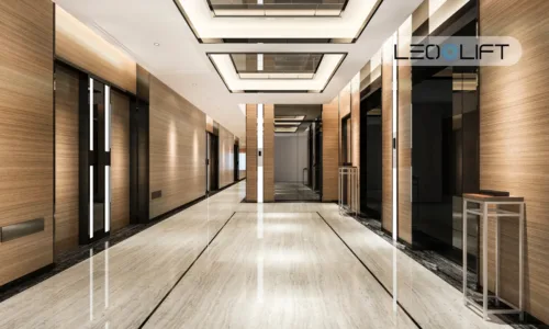 Luxurious hotel hallway with wood-paneled walls, multiple elevator doors along each side, and a marble floor.